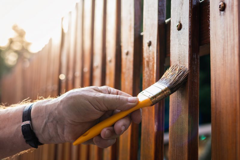 Close-up of Fence Staining Process